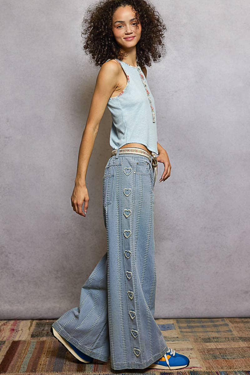 Textured denim side heart patch accents woven pants