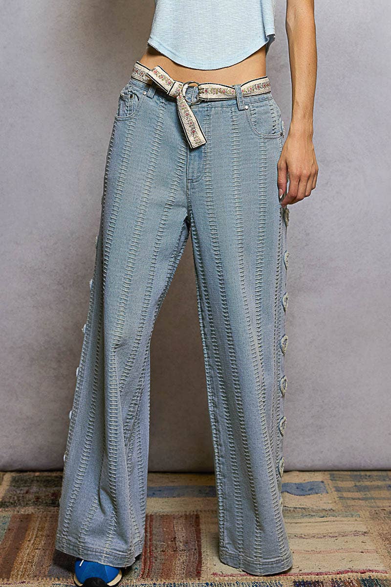 Textured denim side heart patch accents woven pants