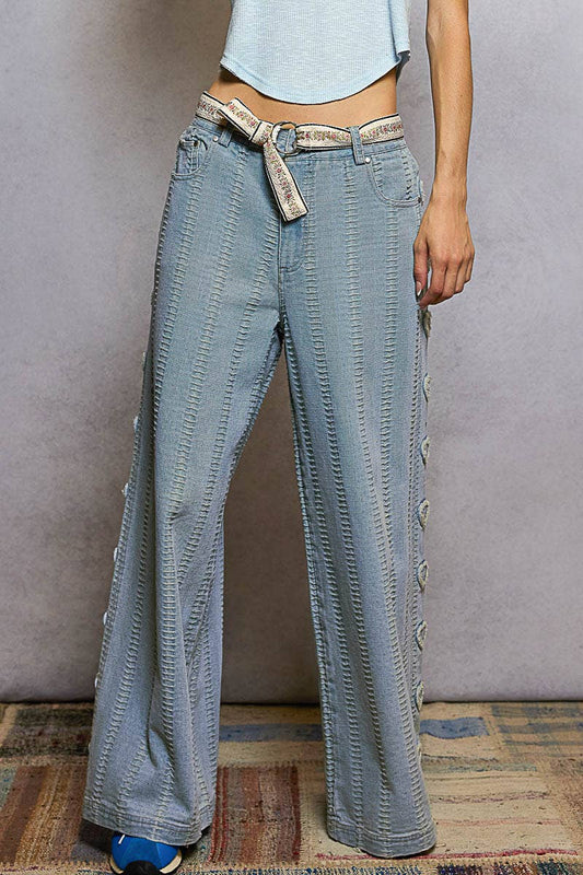 Textured denim side heart patch accents woven pants
