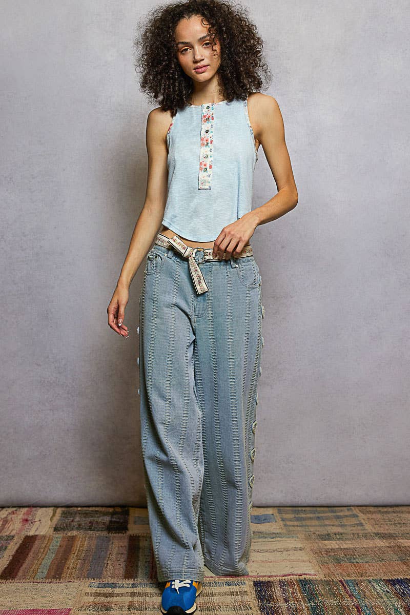 Textured denim side heart patch accents woven pants
