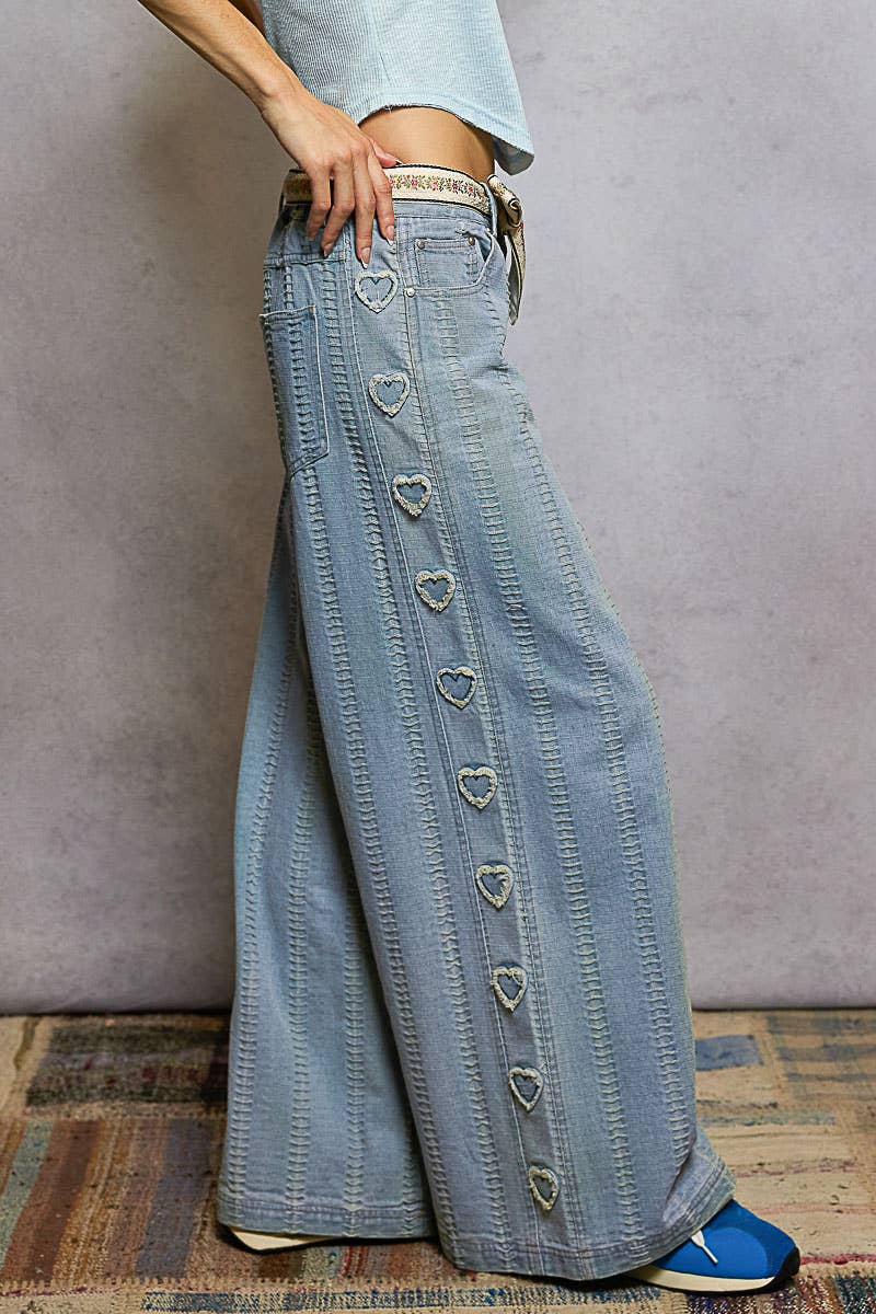 Textured denim side heart patch accents woven pants